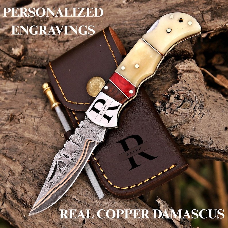 Engraved copper Damascus pocket knife